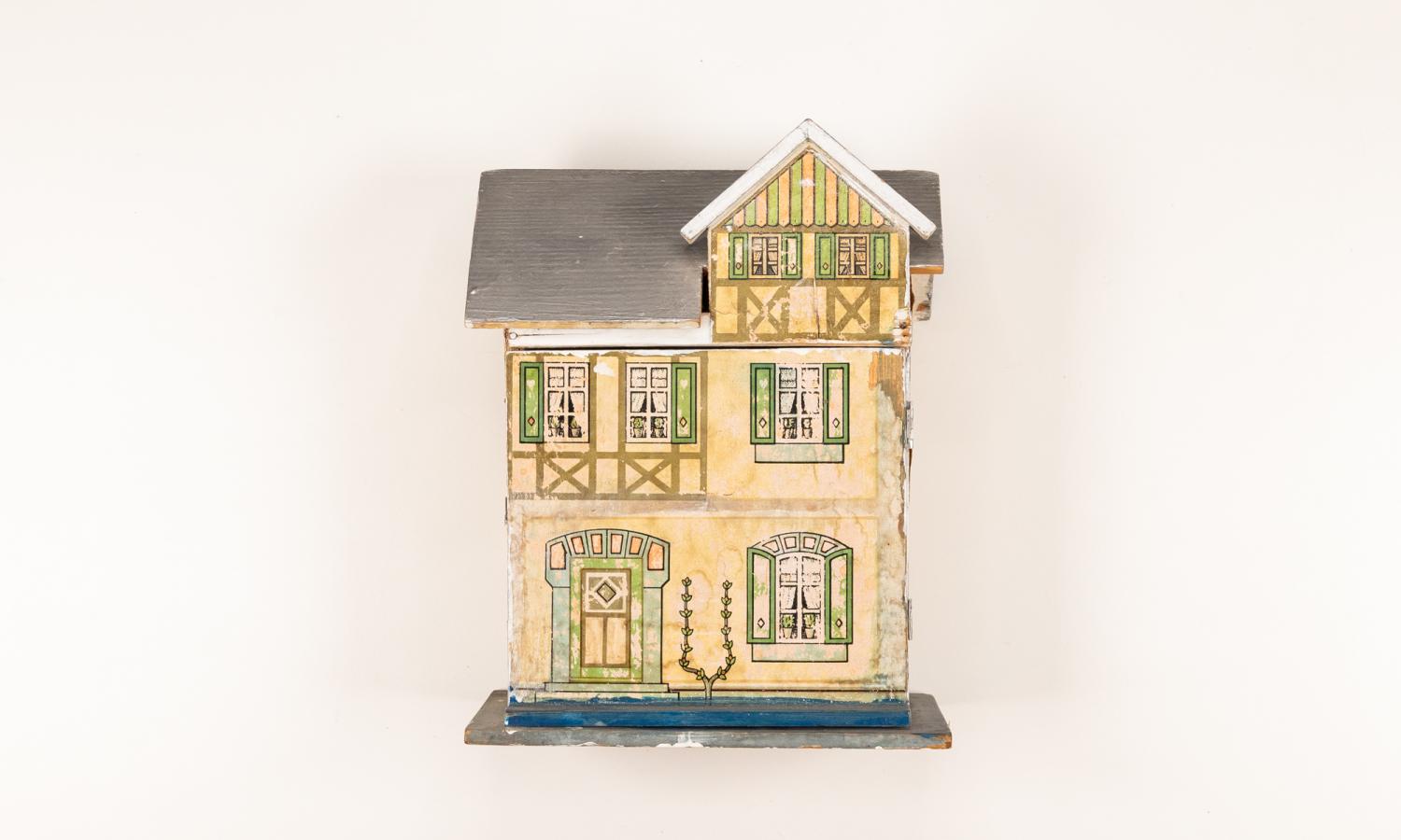 Yellow Model House - Belonged to Mrs. Elna Begenstein. 1893 - 1976