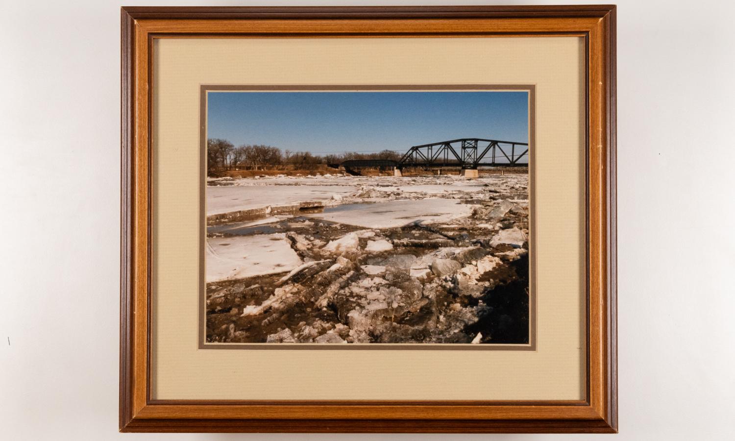 Framed photograph of ice breaking up on the Assiniboine River