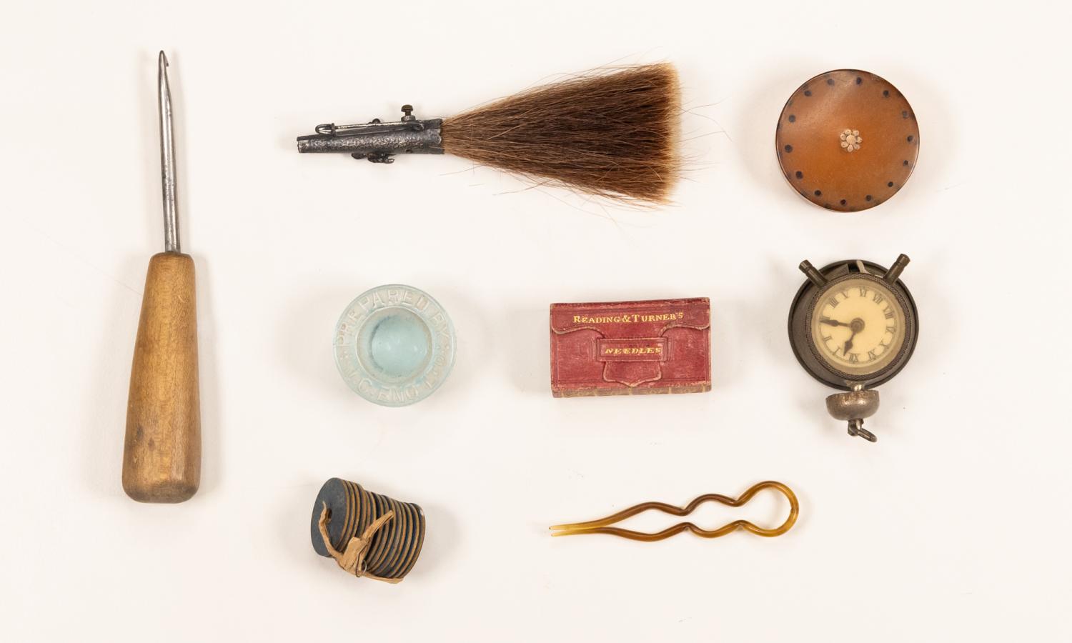 Assorted artifacts - Brush, pocket watch, hair clip, sewing utensil