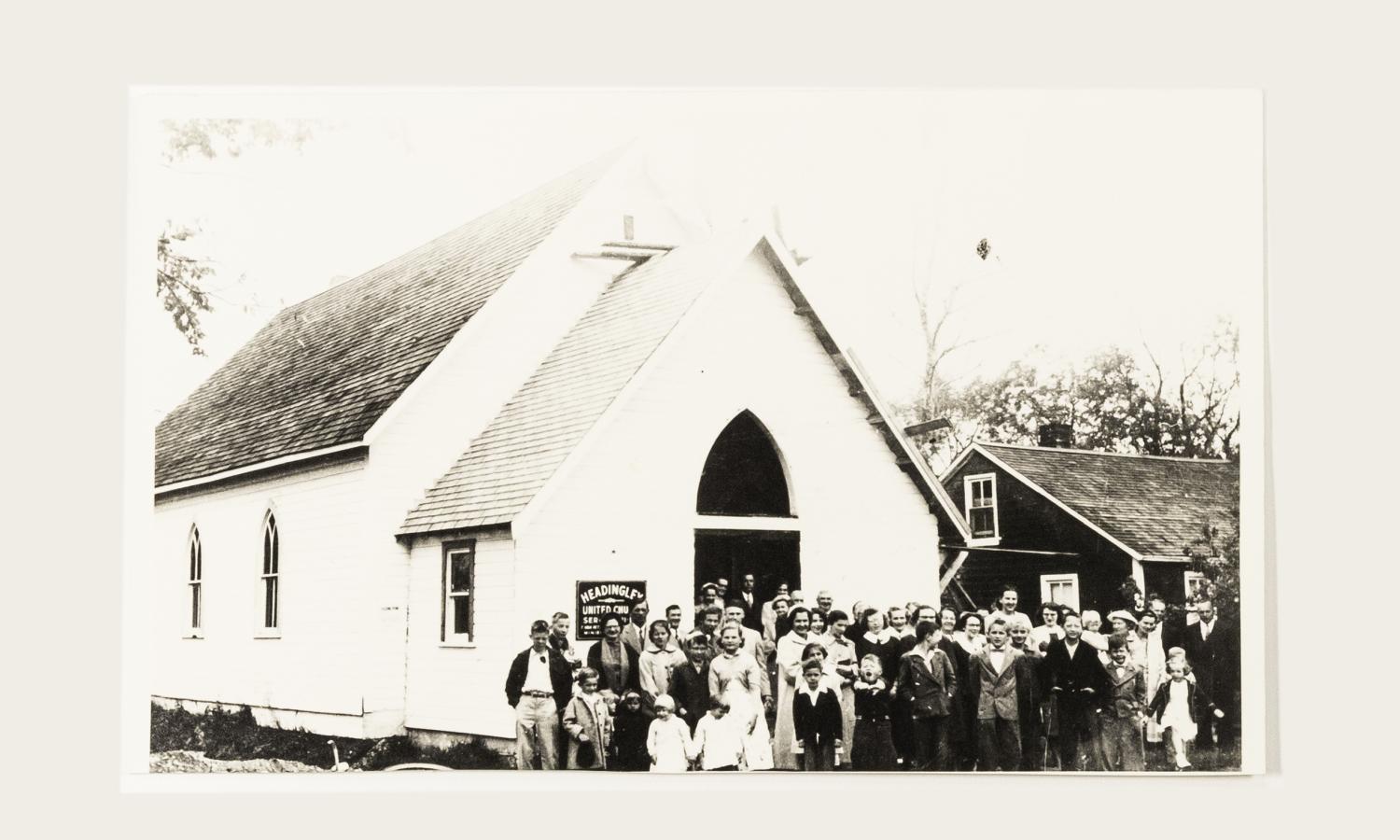 Presbyterian / United Church built in 1911 on Dodds Road replacing church built in 1854 trustees James Black, Merchant, Harry Francis, Merchant. And James Duncan, village of West Winnipeg in 1956 the congregation gathered to celebrate the new addition to the front of the church for choir and furnace.