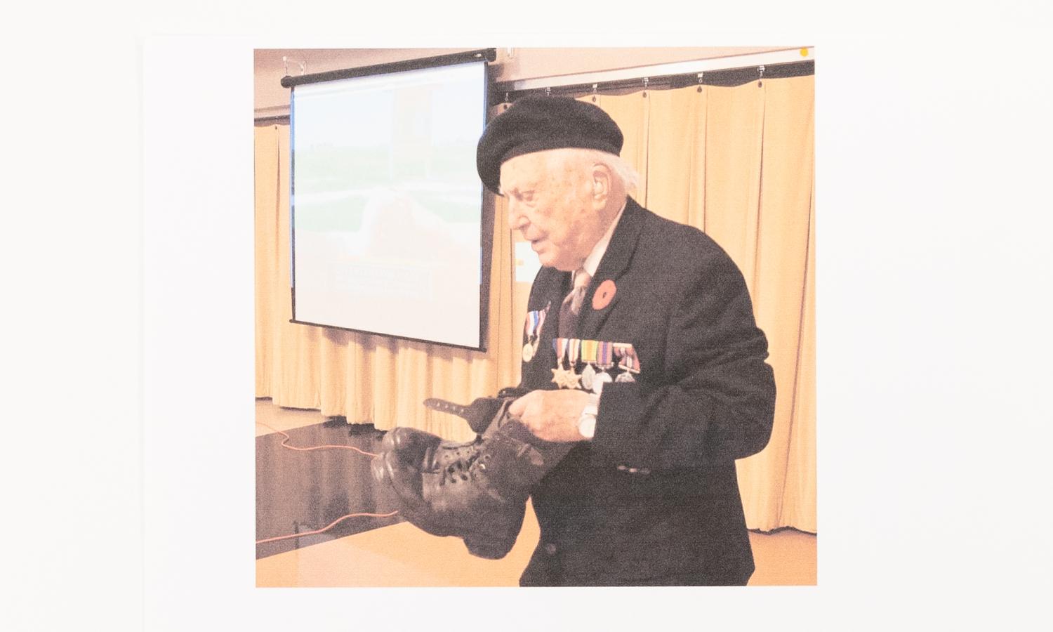 A veteran brings his boots to the ceremony