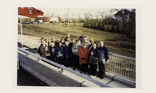 Taylor family with John Taylor's home in background