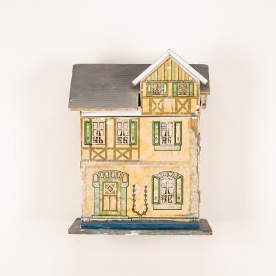 Yellow Model House - Belonged to Mrs. Elna Begenstein. 1893 - 1976