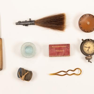 Assorted artifacts - Brush, pocket watch, hair clip, sewing utensil